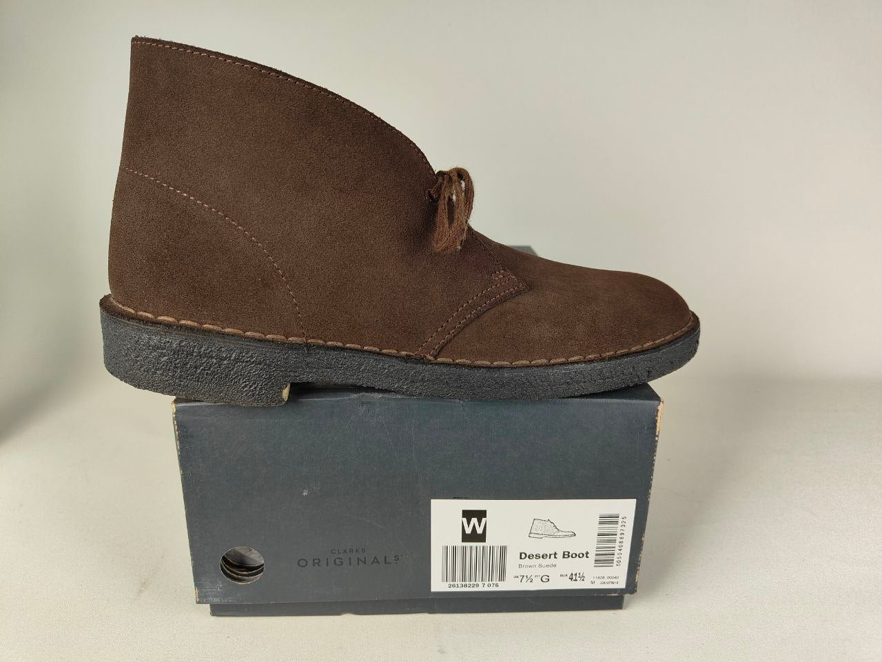 Clarks Originals Desert Boot Brown Steads Suede on a black shoe box with a visible brand label - side view @runinrain