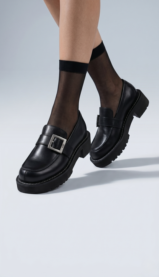 Black GCDS x Clarks 1 with buckles worn with sheer black socks on a light gray background - free style @runinrain