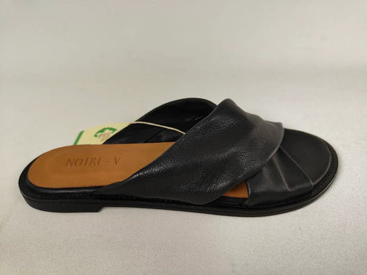 A black Notre-V Elegant Criss-Cross Black Leather Women sandal with open toe on a light gray background – Side View @RunInRain