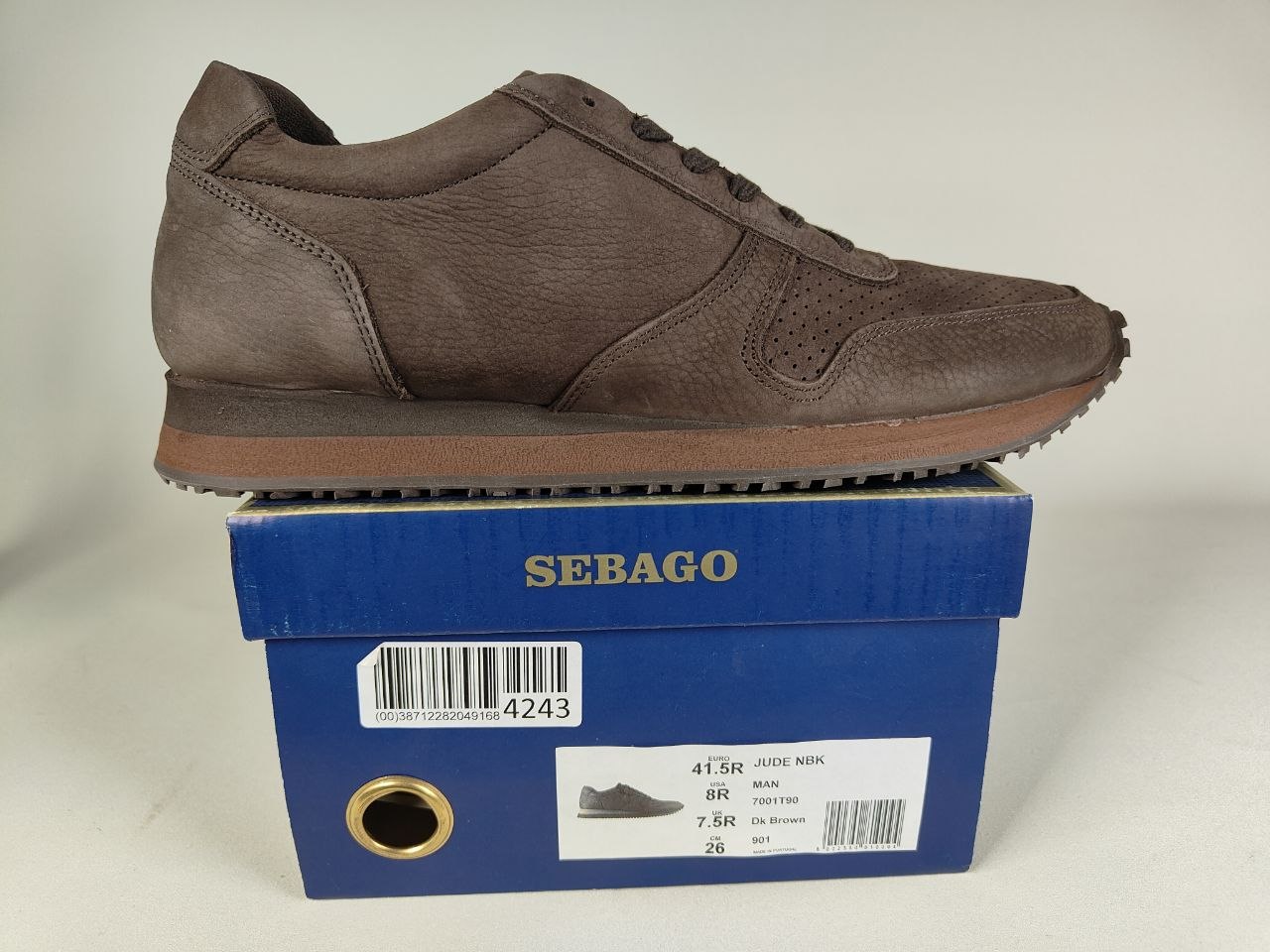 Sebago Jude NBK Dark Brown Shoe on a blue Sebago shoe box against a light gray background