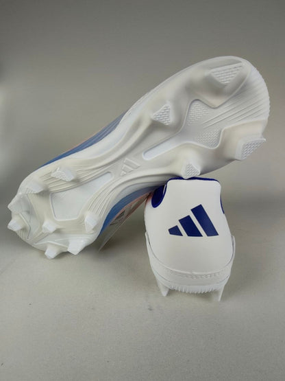 White Adidas F50 Club FxG with blue accents on a gray background - Sole view @runinrain