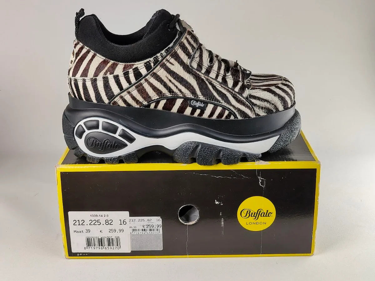 Buffalo London 1339-14 2.0 Zebra Platform Sneakers on top of a yellow and black shoe box with 'Buffalo' branding - detail view @runinrain