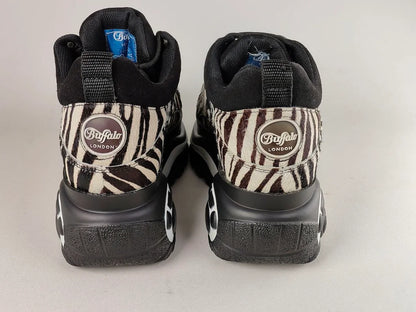 Pair of Buffalo London 1339-14 2.0 Zebra Platform Sneakers soles with 'Buffalo London' branding on a light gray background - rear view @runinrain