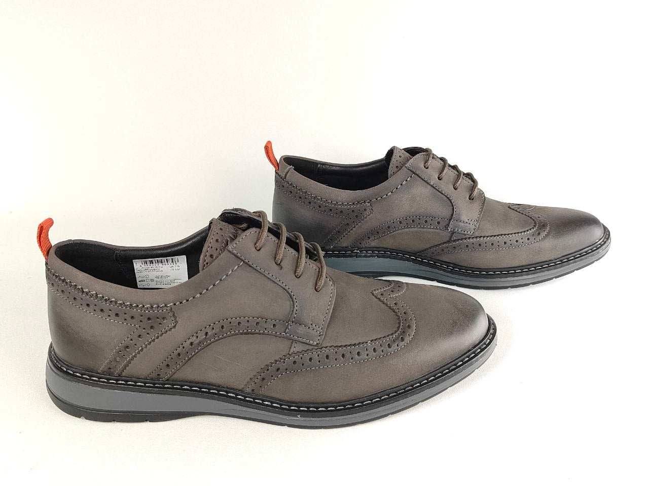Pair of gray leather shoes on a white background
