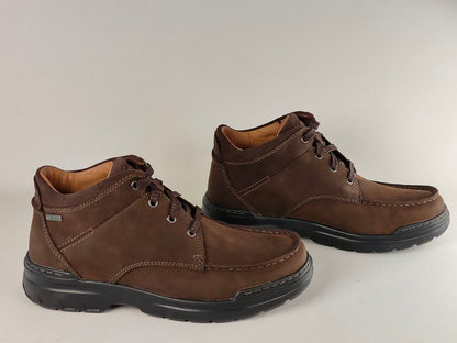 Pair of brown leather boots on a white background