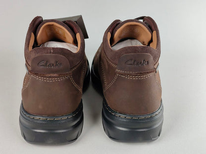Pair of brown Clarks shoes on a light gray background