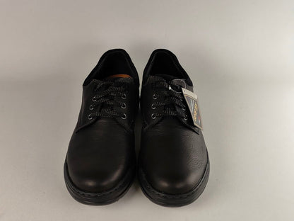 Pair of black shoes on a light gray background