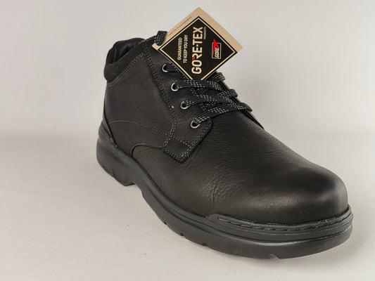 Black leather boot with GORE-TEX label on a light gray background