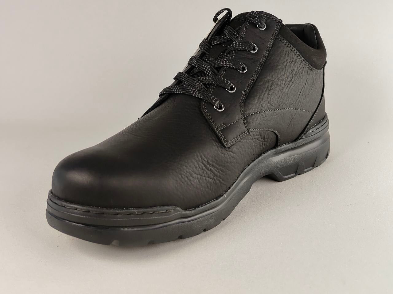 Black leather boot with laces on a light gray background