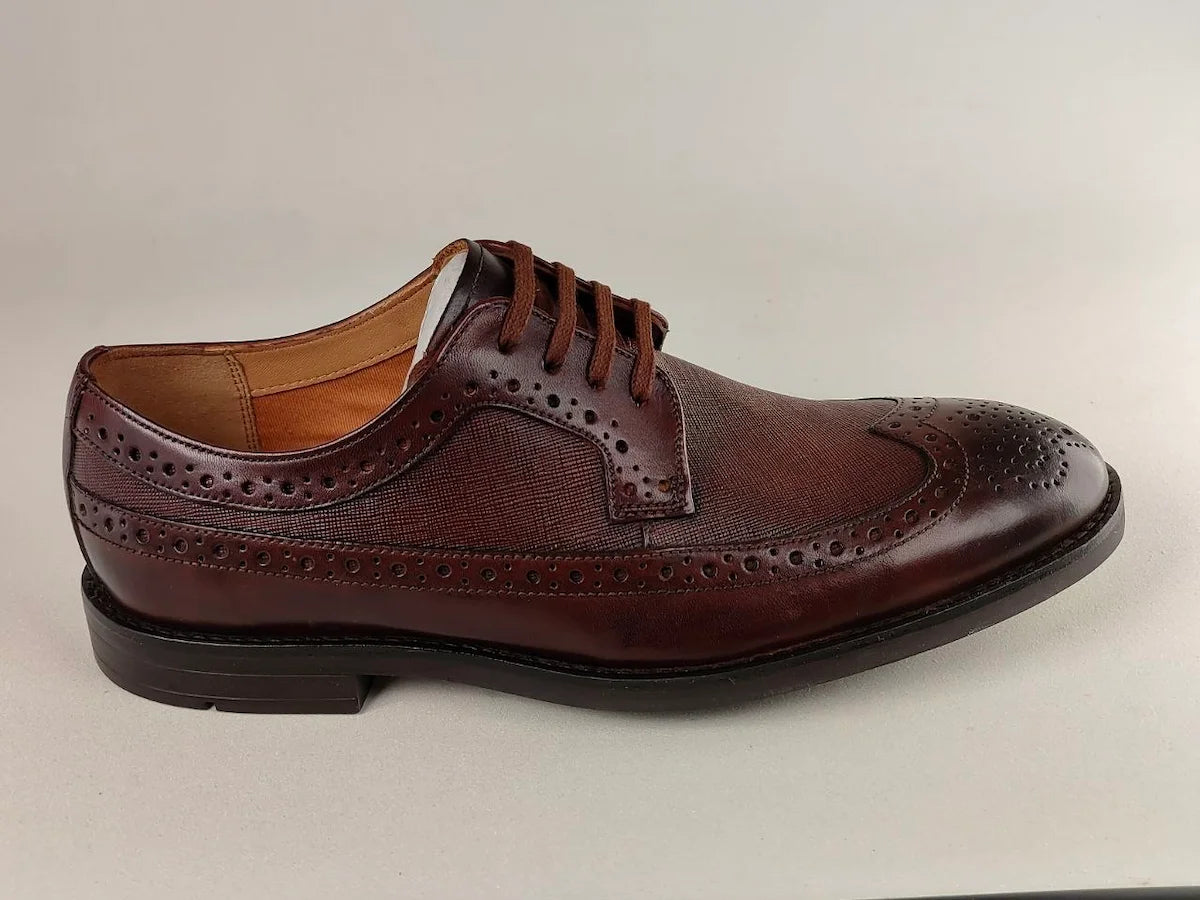 A dark tan Clarks Ronnie Limit men's Full-Grain shoe on a light gray background - side view @runinrain