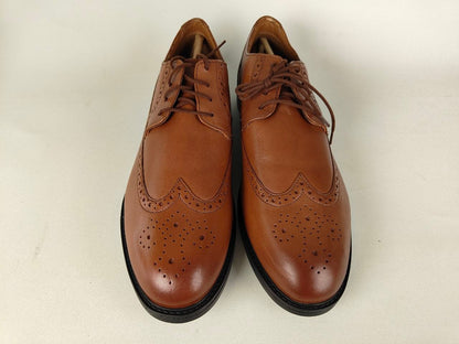 A pair of Clarks Beckfield Limit Men's Tan Leather Wingtip Brogue shoes on a white background - front view @runinrain