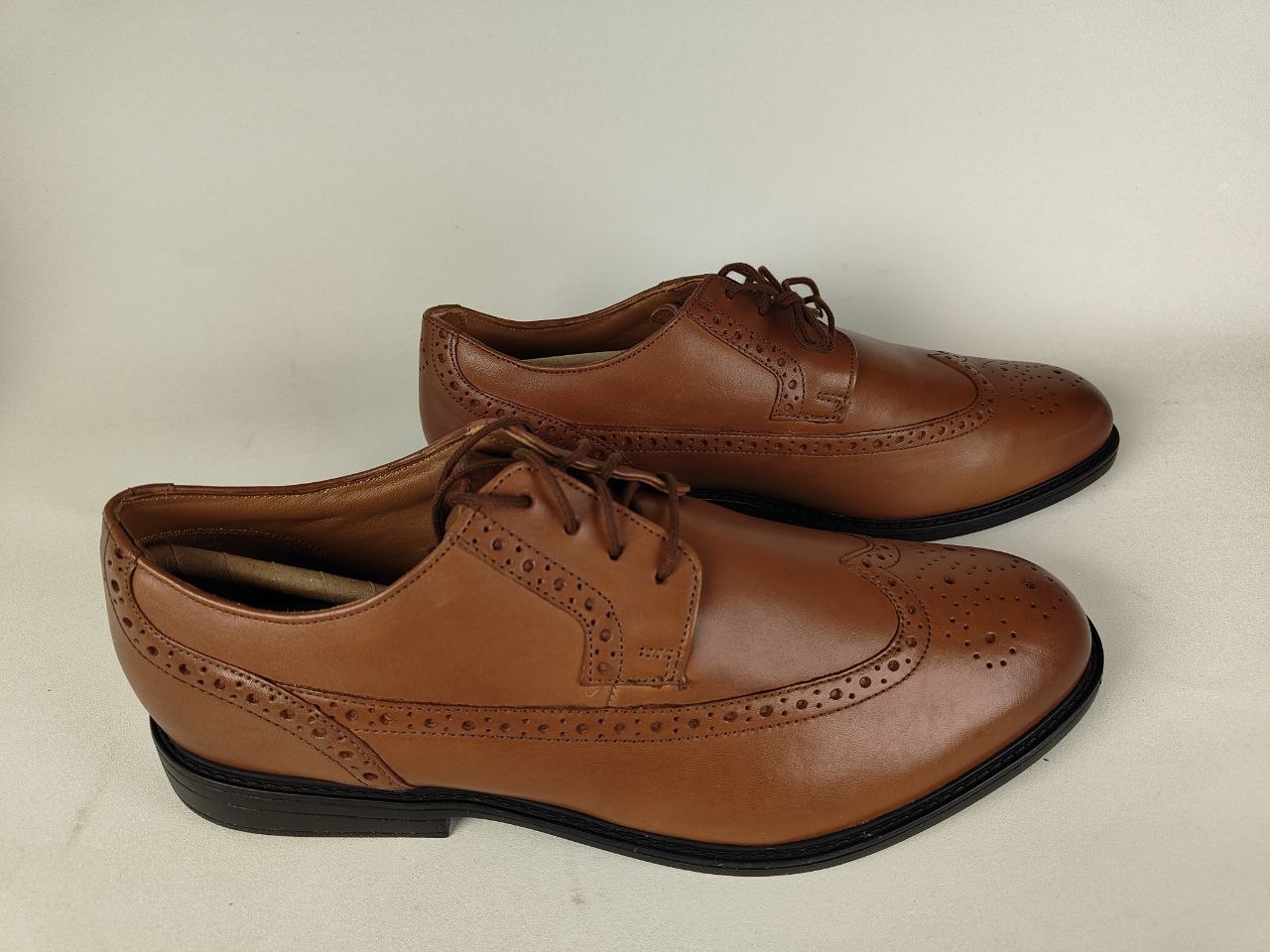 Clarks Beckfield Limit Men's Tan Leather Wingtip Brogue on a light gray background – Side View hero shot @RunInRain