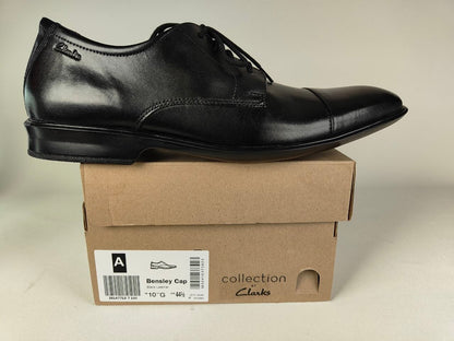 A Clarks Bensley Cap Men's Black Leather Oxford shoe on a Clarks Collection branded box on a light gray background - detail view @runinrain
