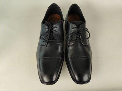 A pair of Clarks Bensley Cap Men's Black Leather Oxford shoes on a light gray background – Top view @RunInRain