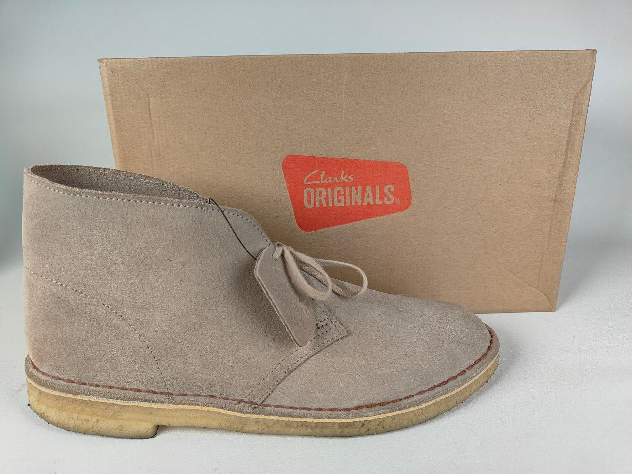 Clarks Originals Desert Boot Sand Steads Suede with a Clarks Originals box on a light gray background - side view @runinrain