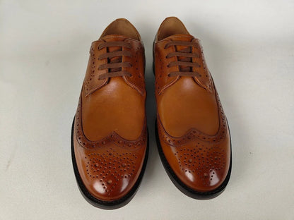 A pair of clarks Ronnie Limit Men's Tan Full-Grain Leather Oxford – Front View @RunInRain