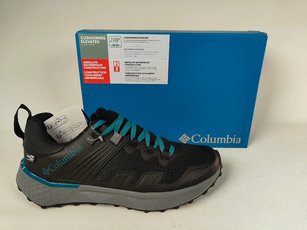Columbia Peakfreak II OutDry hiking shoe with teal accents next to original blue box | RunInRain