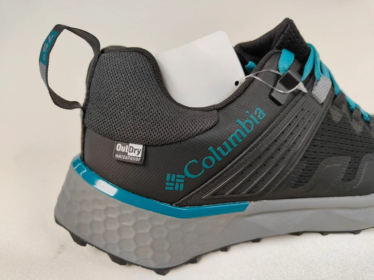 Columbia Peakfreak II OutDry waterproof trail shoe in black and blue – Side View | RunInRain
