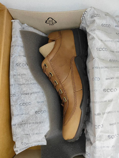 Tan leather shoe in a cardboard box with ECCO branding.