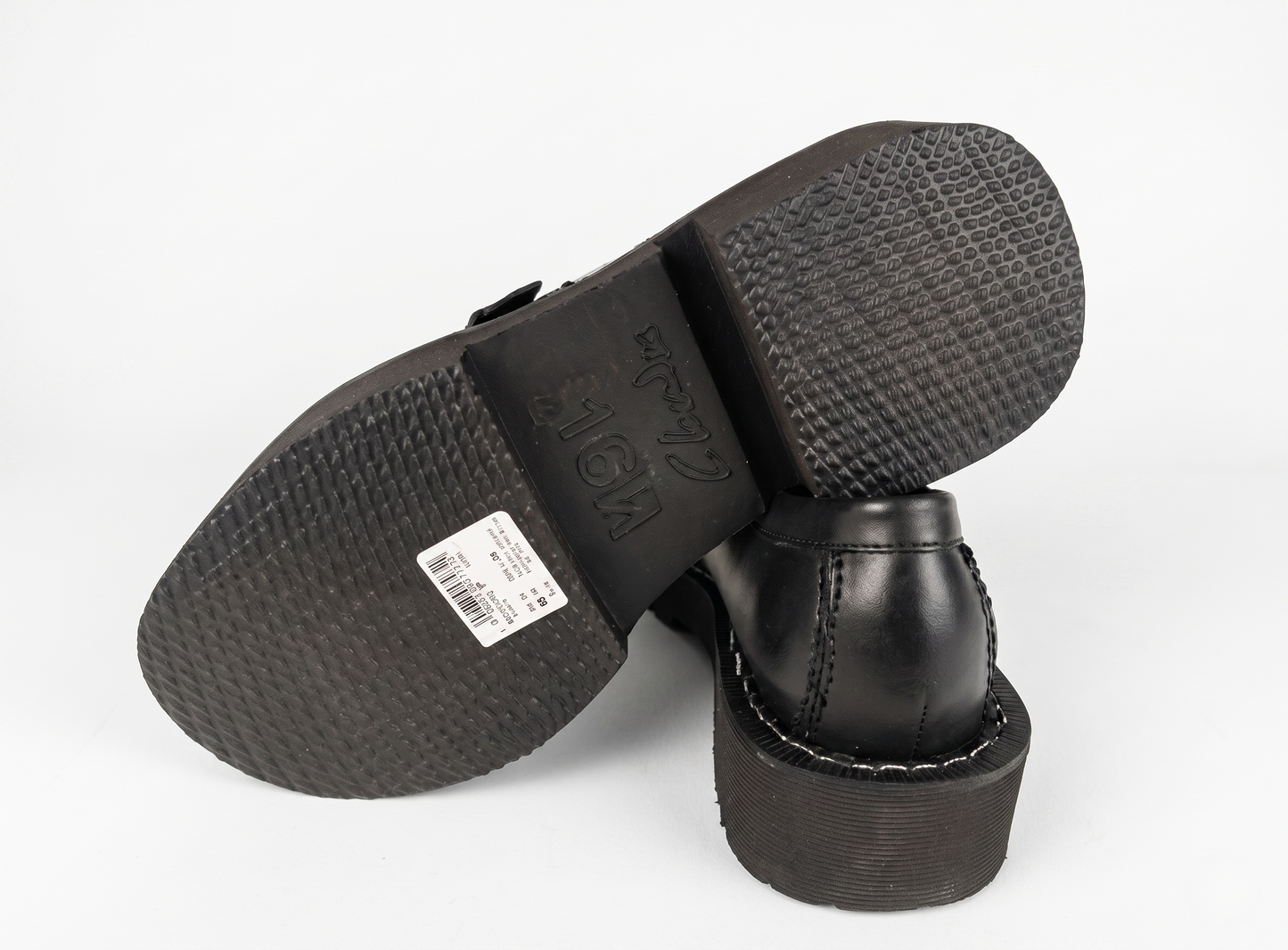 Black GCDS x Clarks 1 – Limited Edition Leather Loafers with sole showing brand name and size on a white background - Sole view @runinrain