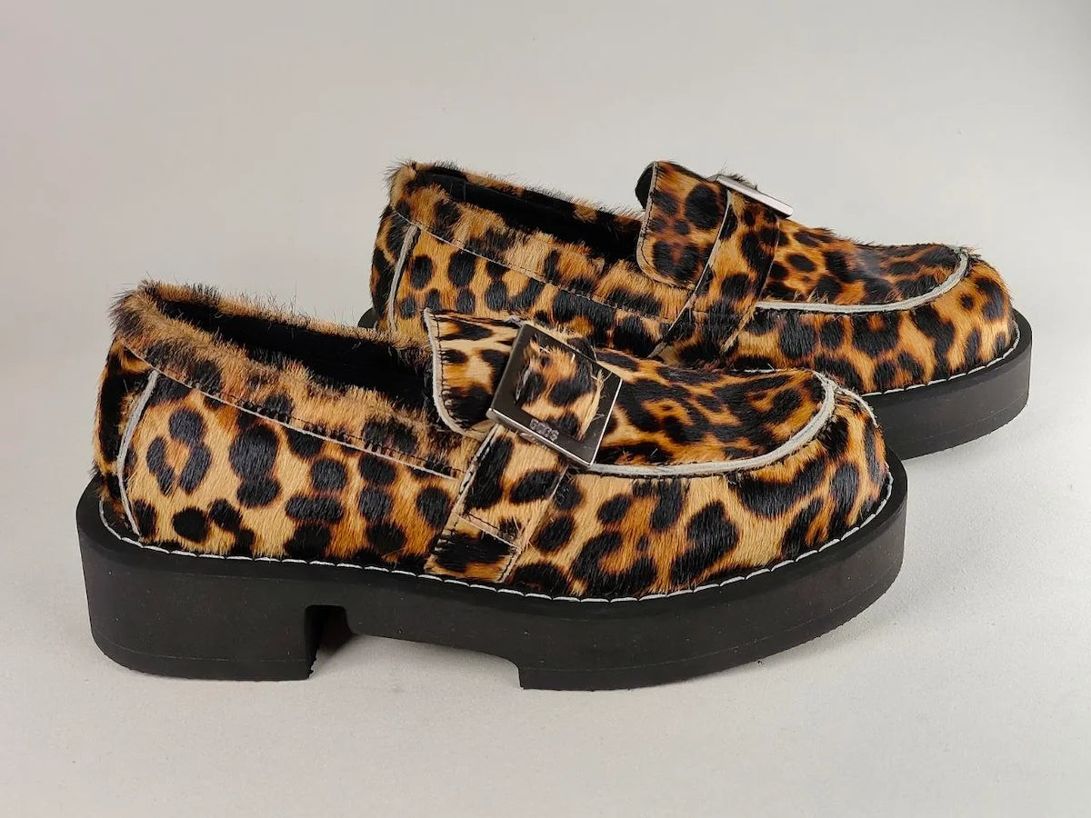 Leopard print GCDSxClarks1 Limited Edition Leather loafers on a light gray background