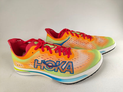 A pair of Hoka Cielo FlyX Carbon-Plated Track Spikes Solar Flare with 'Hoka' branding on a light background – Side View hero shot @RunInRain 