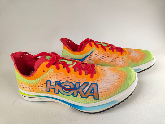 A pair of Hoka Cielo FlyX Carbon-Plated Track Spikes Solar Flare with 'Hoka' branding on a light background – Side View hero shot @RunInRain 