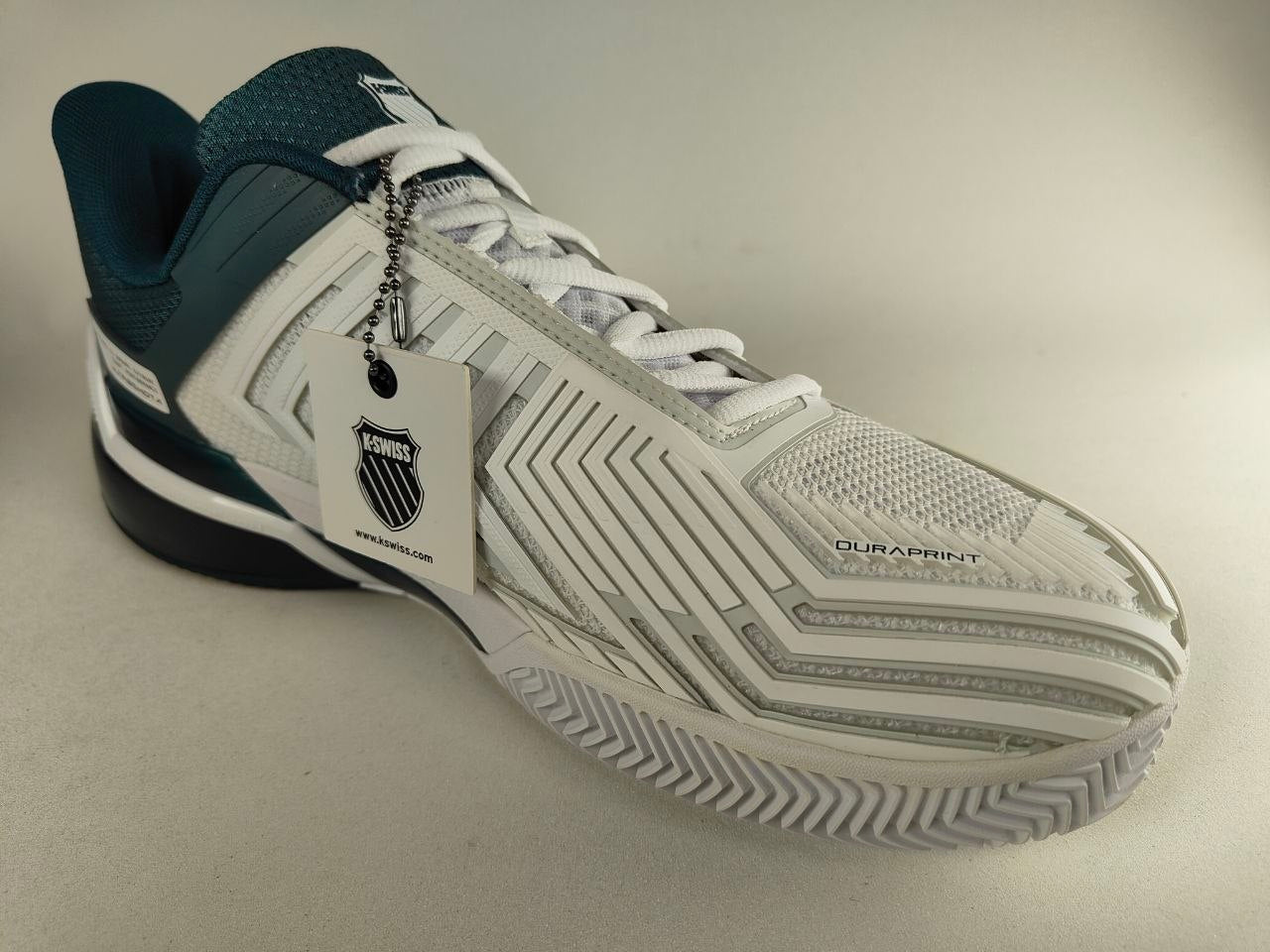 K-Swiss Ultrashot 4 men's clay court tennis shoe in white and dark Blue, durable grip outsole for clay surfaces - 3q view @RunInRain