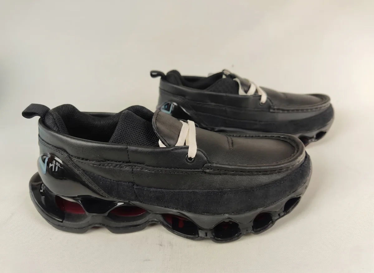 Mizuno Wave Prophecy Moc black leather men's running shoes – rear three-quarter view showing Wave Prophecy cushioning sole with red accents and white laces on white background @runinrain