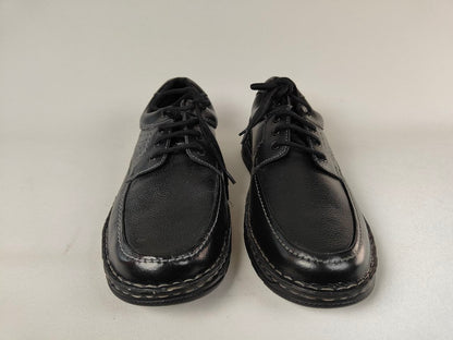 Pair of black Orchard_ Anatomical Leather Loafers on a white background