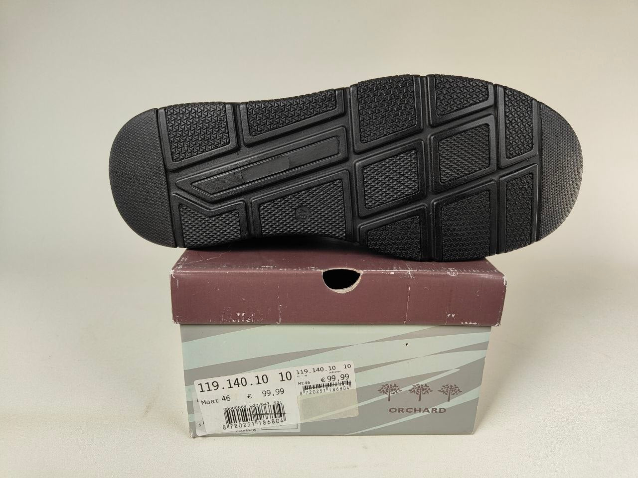 Black Orchard Leather Loafers shoe sole on a cardboard box with the brand name