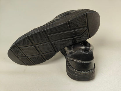 Black Orchard Anatomical Leather Loafers shoes with textured soles on a light gray background