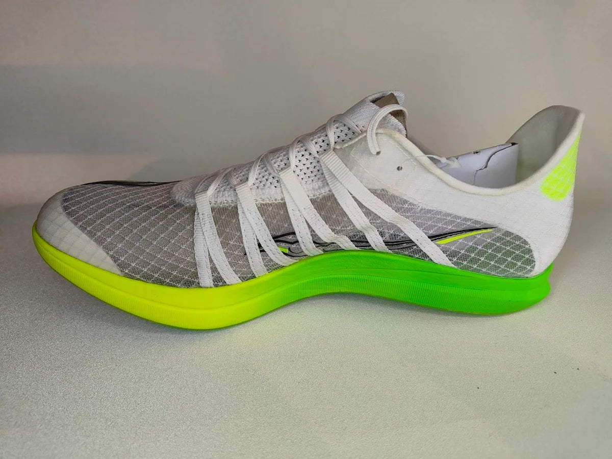 Gray and white Saucony Terminal VT shoe with a bright green sole on a light gray background - Side view @runinrain