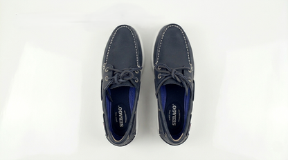 Pair of navy blue Sebago Docksides Portland Women's Nautical Loafers with white laces on a white background – Sole View @RunInRain