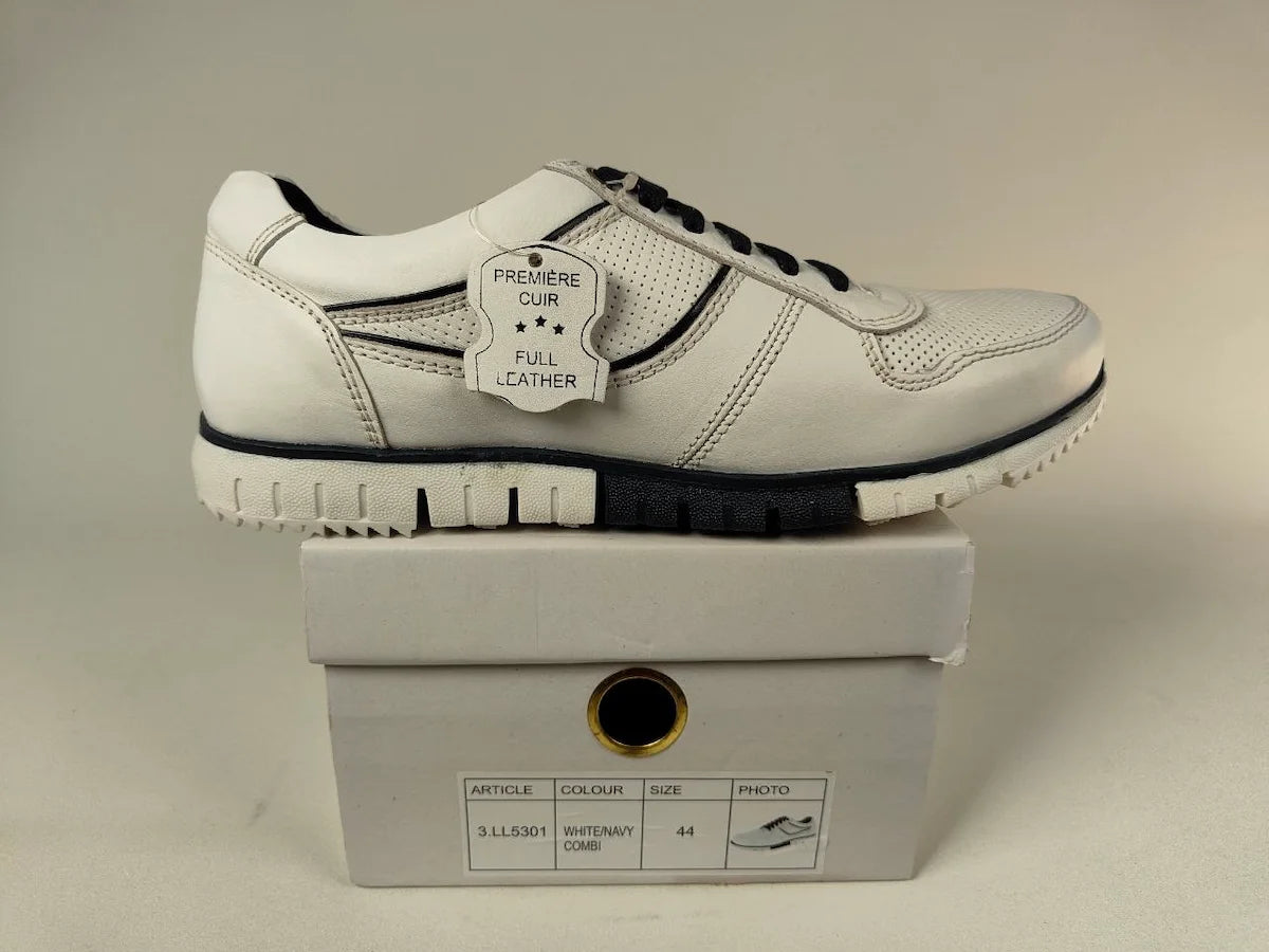 White Cafe moda Urban Chic Sneakers with black accents on a matching box against a neutral background - Side view @runinrain