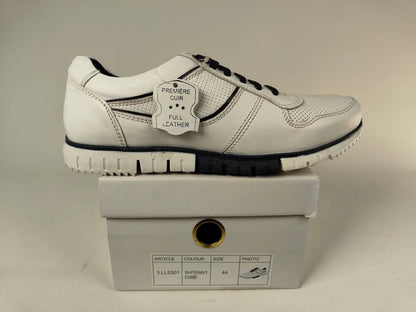 White Cafe moda Urban Chic Sneakers with black accents on a matching box against a neutral background - Side view @runinrain