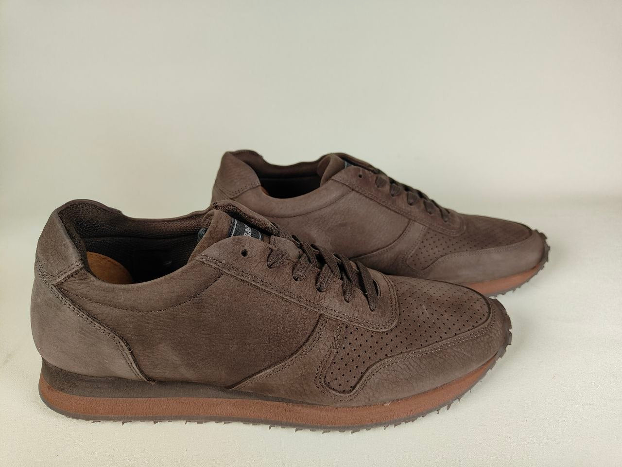 Pair of Sebago Jude NBK Dark Brown Sneakers on a light gray background