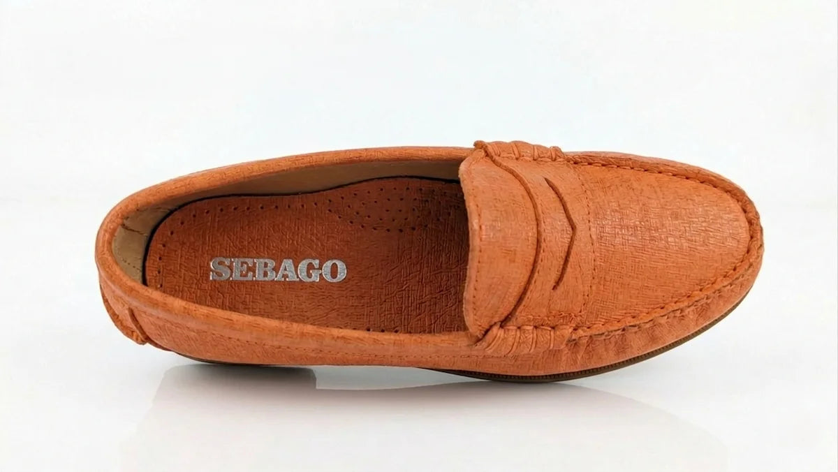 Sebago Plaza women's Orange Loafer with 'Sebago' branding on a white background - top view @runinrain